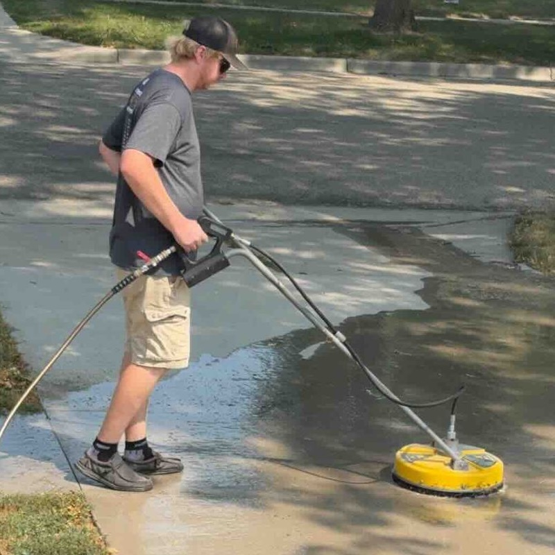 Driveway power washing in progress